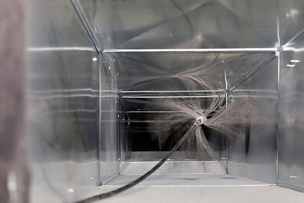 Air duct cleaning equipment connected to a home vent