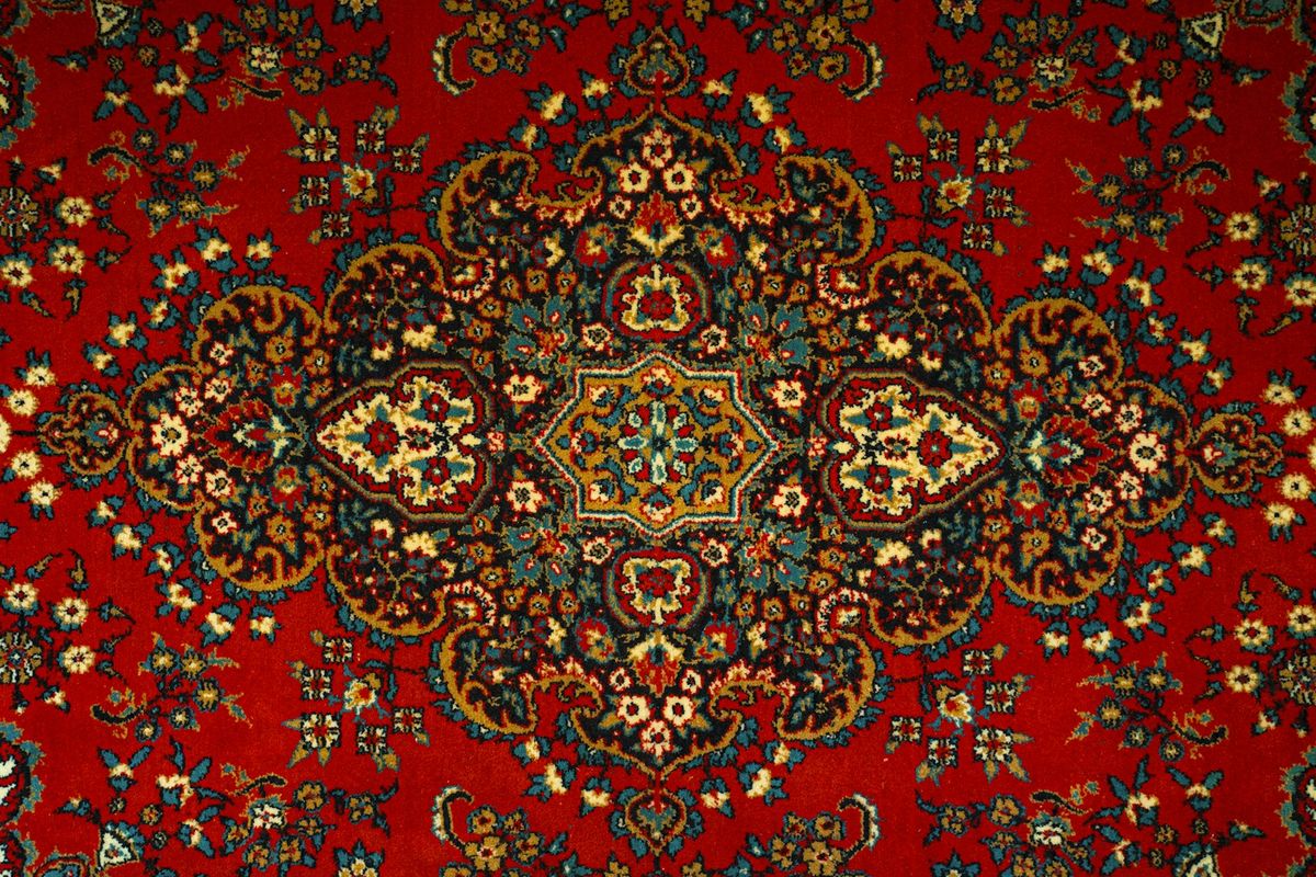 Close-up of a red patterned area rug