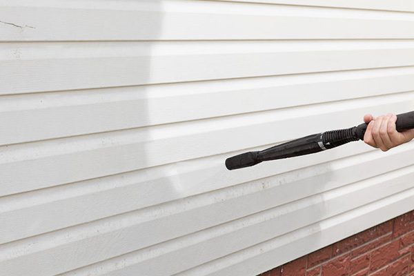Soft washing a house's siding